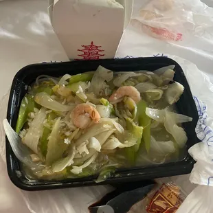 a tray of noodles and shrimp