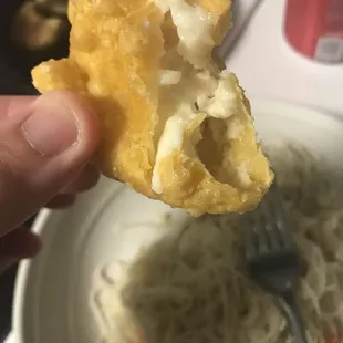Inside of crab Rangoon. The outside of these were so nice and crunchy, with the inside being sweet and delicious.