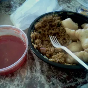 Sweet &amp; sour chicken lunch combo. Eggroll already eaten and dipped in sauce :))) Full and still alot left.