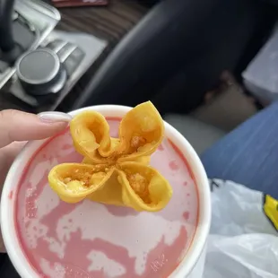 a person holding a bowl of food