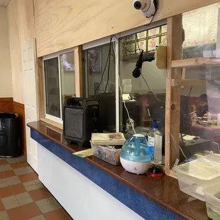 portable speaker system for communicate purposes, bottom right is the mechanism they have selected to send and retrieve receipts