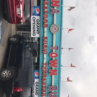 cars parked in front of the restaurant