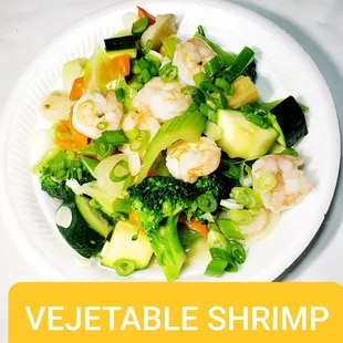 a plate of vegetables and shrimp