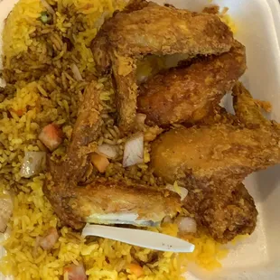 chicken and rice in a styrofoam container