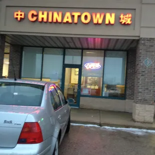 a car parked in front of the restaurant