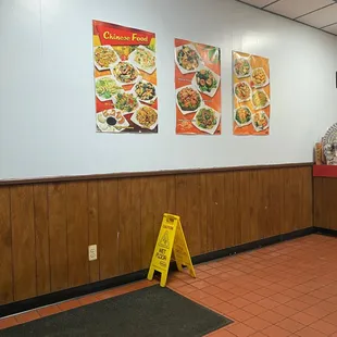a man standing in a restaurant waiting for customers