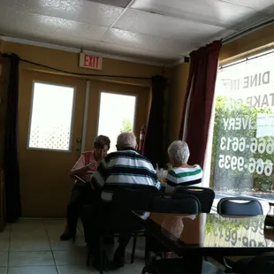 a group of people sitting at a table