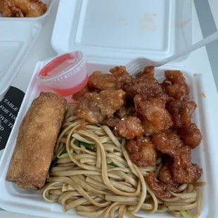 a plate of noodles and chicken