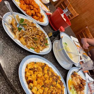 a table full of chinese food