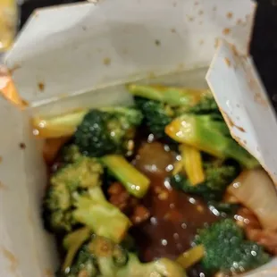 broccoli and other vegetables in a paper container