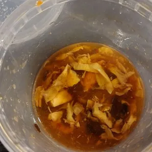 a bowl of soup with a lid