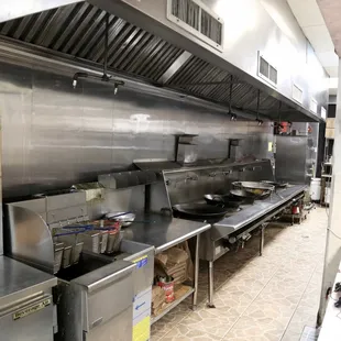a commercial kitchen with stainless steel appliances