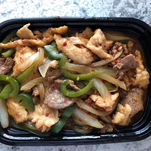 Pan fried shredded beef and chicken with bell peppers and onions from the secrete menu. Very delicious!
