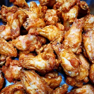 a pile of chicken wings