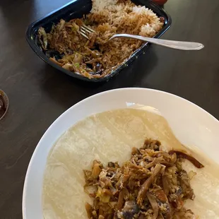 a plate of food and a bowl of rice