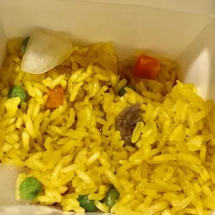 rice and vegetables in a white container
