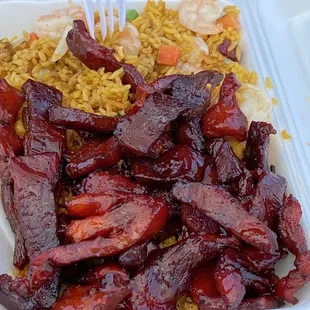 a container of food with rice and meat