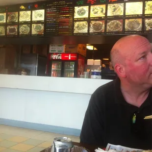 a man eating at a restaurant