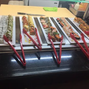 various types of sushi on display