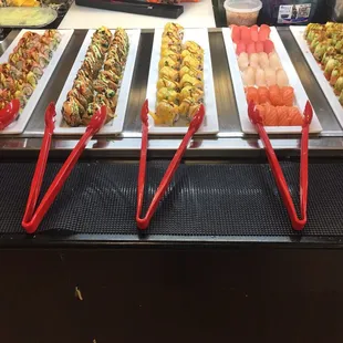 various types of sushi on trays