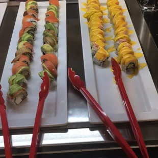 a variety of sushi rolls on plates