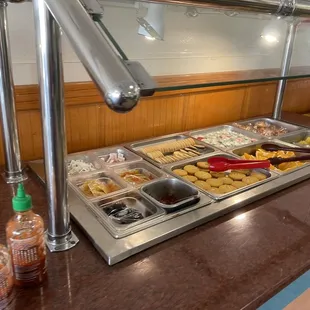 a buffet with a variety of food items