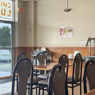 empty tables and chairs in a restaurant