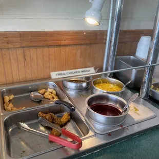 a buffet with a variety of food items