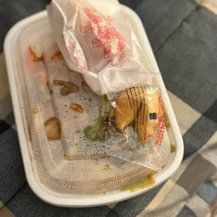 To go: Chicken with garlic sauce w/ white rice. Fried egg role comes with it. Side Chinese cookie