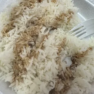 a plate of rice and a fork