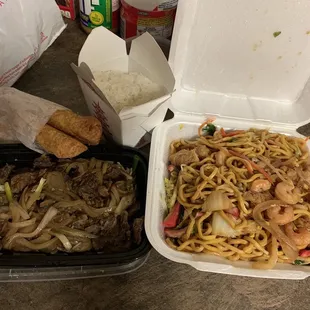 two take out containers of food