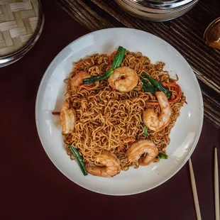 a plate of noodles and shrimp