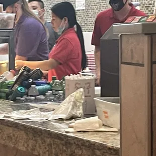 a group of people preparing food