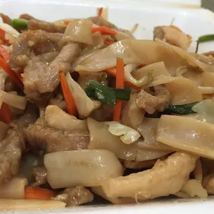 a plate of stir fried food