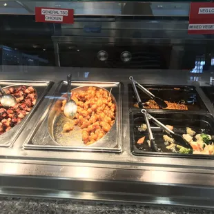 a variety of food items in a buffet