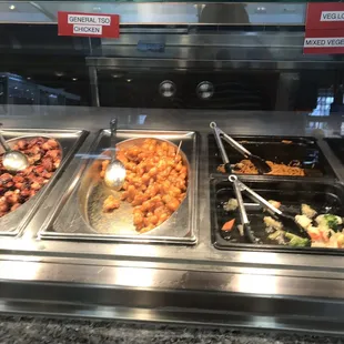 a variety of food items in a buffet