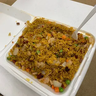 a container of rice and vegetables