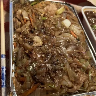 Moo Shu Chicken served with pancake wrappers and sauce $12