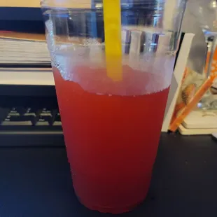 a drink in a plastic cup with a straw