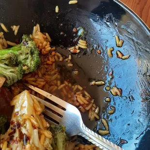 broccoli and rice in a wok