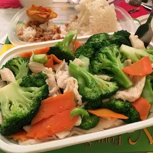 broccoli, carrots, and rice on a plate