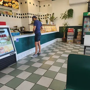 a man standing at a counter