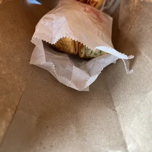 a sandwich wrapped in wax paper