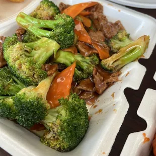 broccoli, carrots, and meat in a styrofoam container