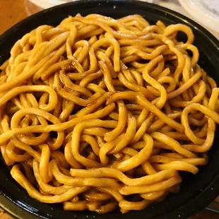 a bowl of noodles on a table