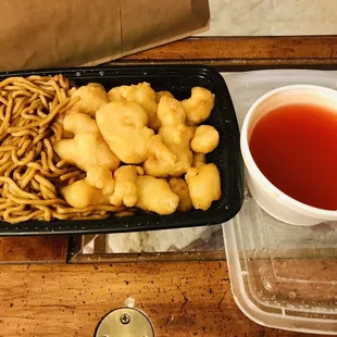 a tray of noodles and a cup of tea