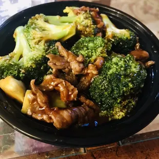 a bowl of broccoli and meat