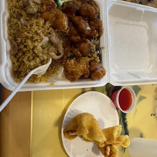 Lunch special orange chicken, includes chicken fried rice and 2 crab rangoon.