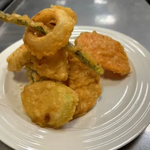 a plate of fried onion rings
