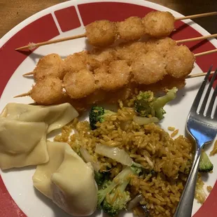 Shrimp on a stick, fried rice, wonton.